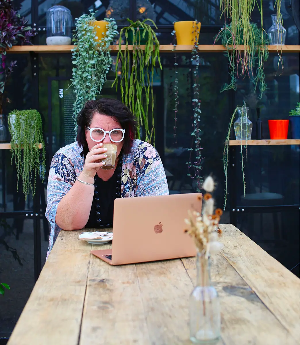 Pauline Stockhausen, director of Stockhausen & Co, sipping a coffee at a cafe